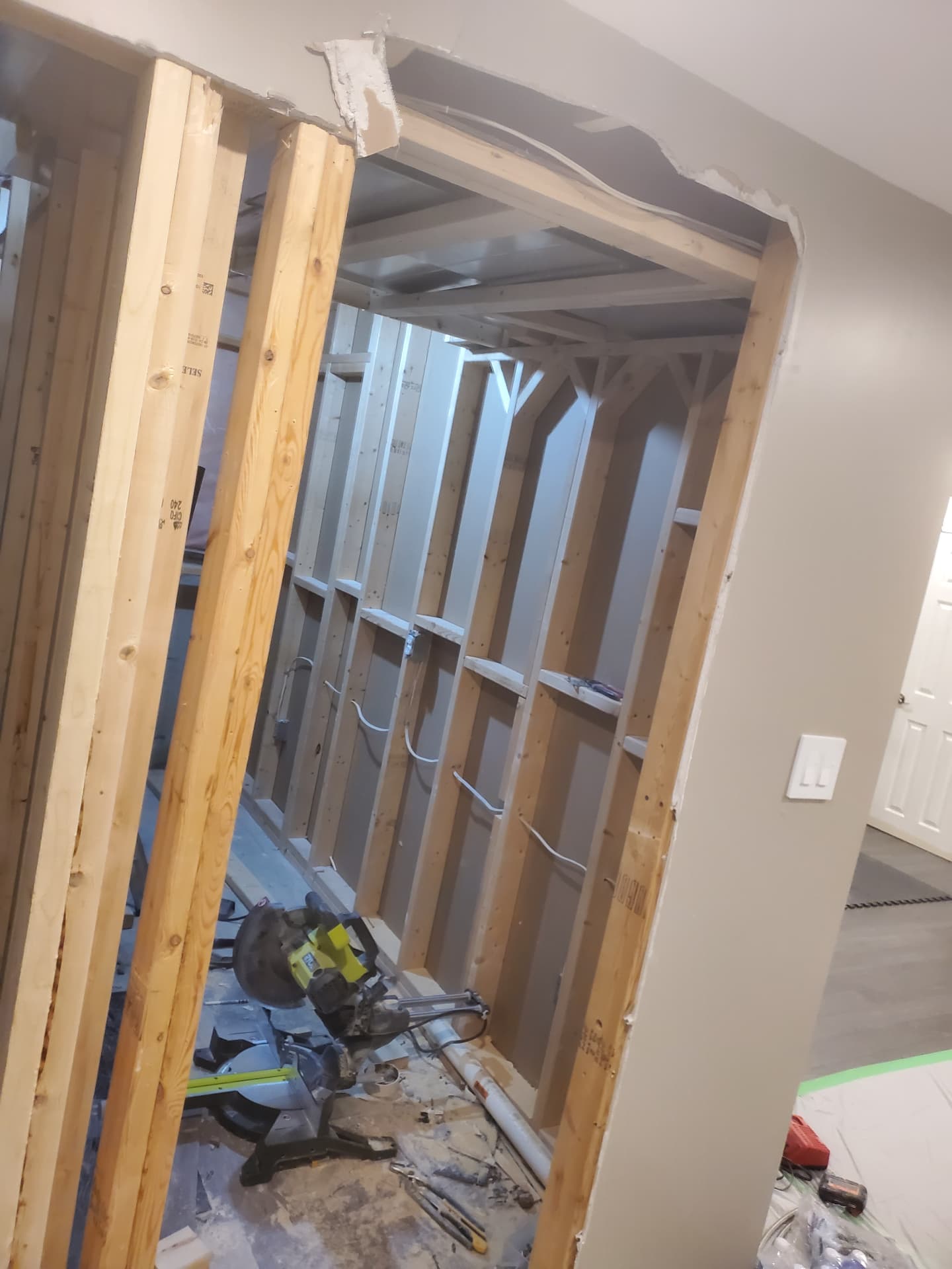 Structural framing modifications and opening framed at the basement entry