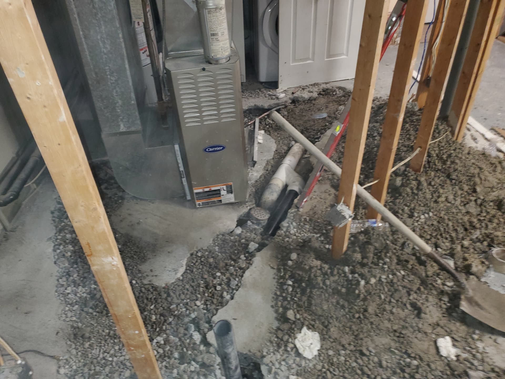 Trenching for drainage lines beside mechanical equipment