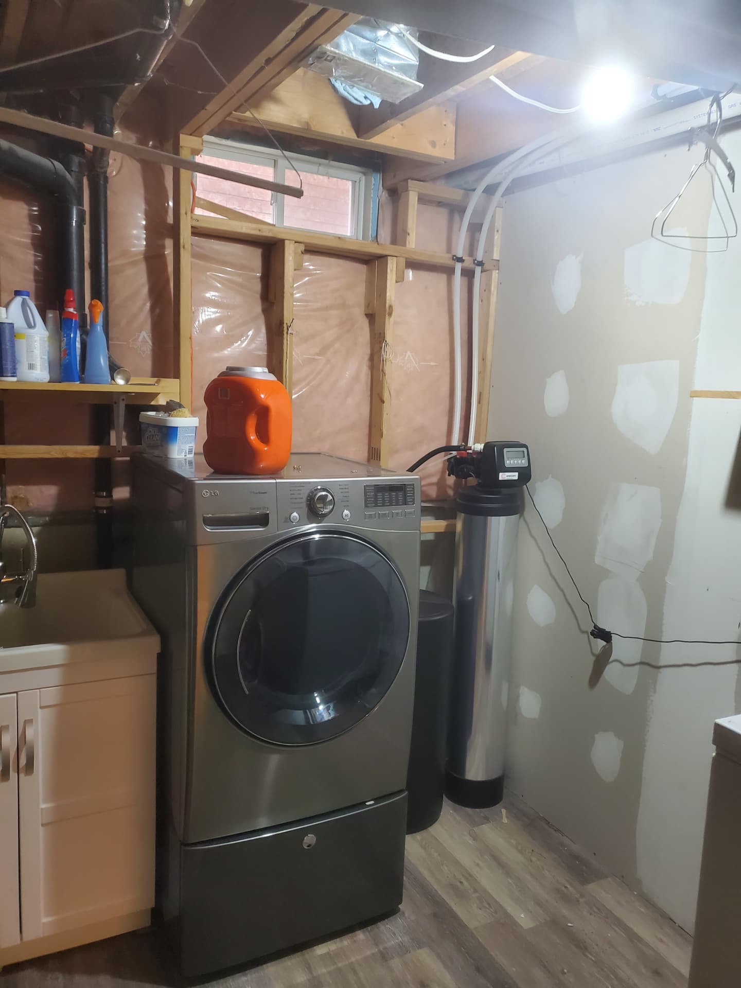 Existing basement laundry area before renovation