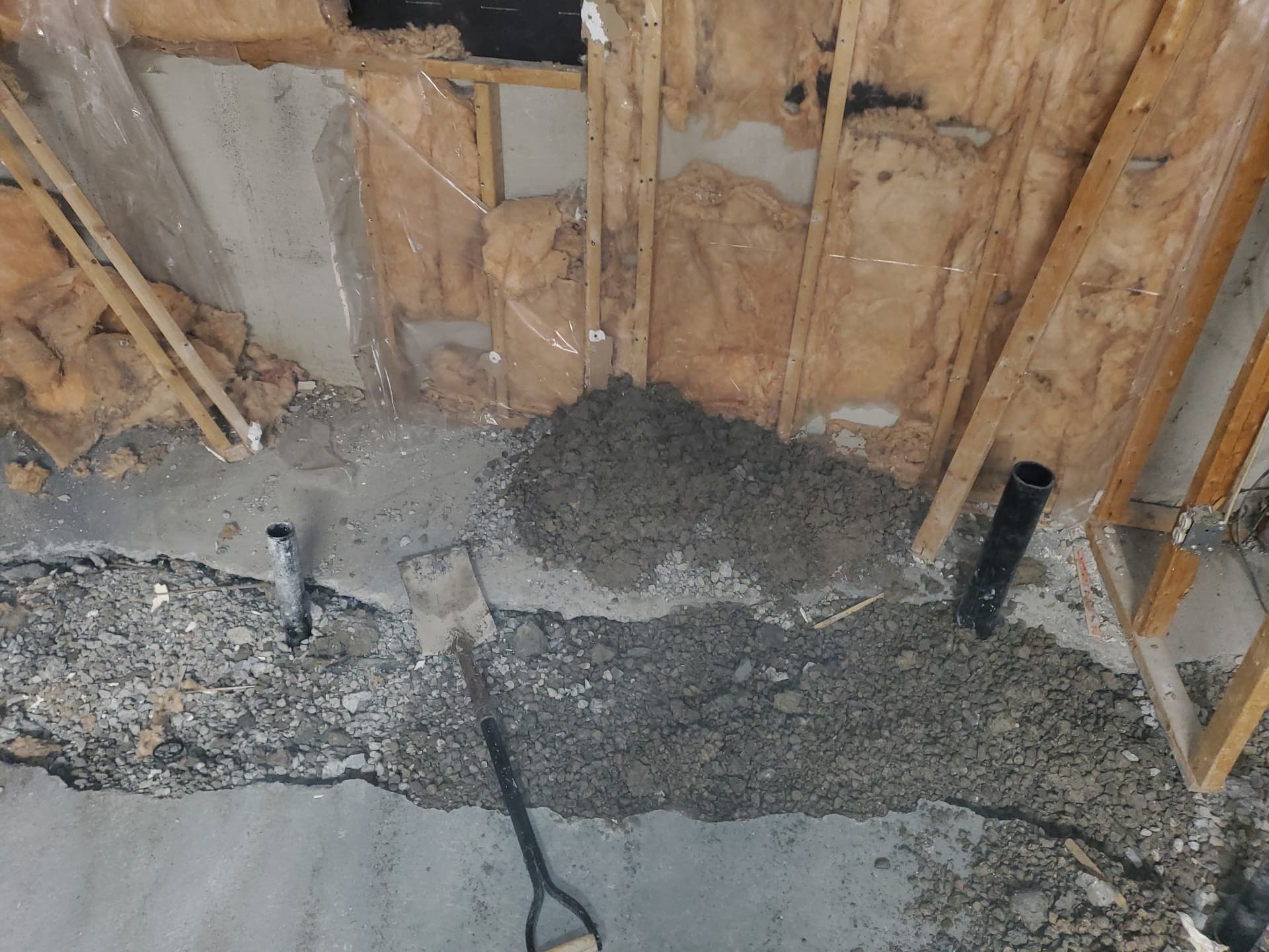 Concrete slab opened for new underground plumbing