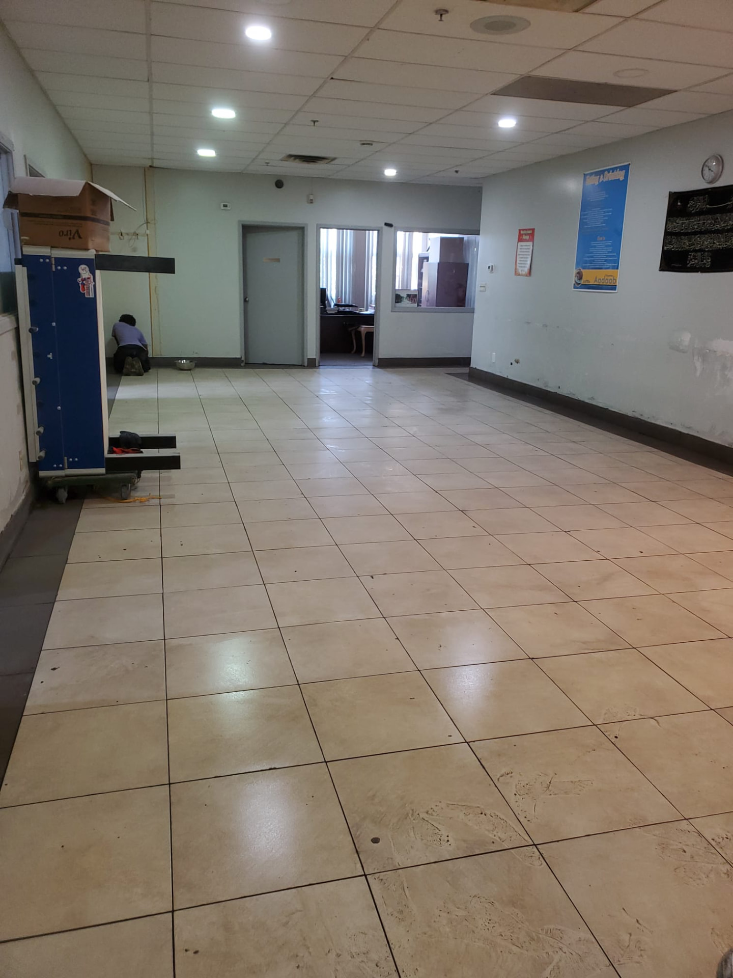 Finished tiled interior corridor and open area after renovation